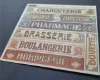 Picture of 1/35 Shop & Business Signs on Real Wood – France Set 5 – Sheet 9.5×10cm - Reality in Scale 35278