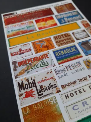 Picture of 1/35 Rusted Business & Shop Signs – France – Sheet 10×14cm - Reality in Scale 35284