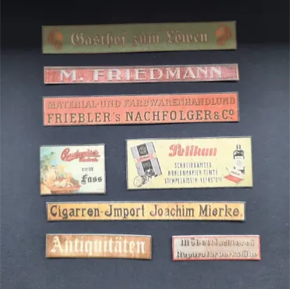 Picture of 1/35 Shop & Business Signs on Real Wood – Germany Set 1 – Sheet 9.5×10cm - Reality in Scale 35288
